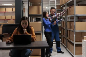 Staff managing warehouse storage